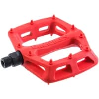 Red DMR V6 plastic pedal with textured surface, nine grip pins, and black spindle attachment.