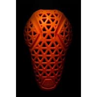 Black MT500 D3O® Lite knee pads with orange geometric pattern and flexible protective shell.