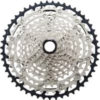 Silver and black Shimano CS-M7100 SLX 12-speed cassette with 10-51T gear range, featuring a detailed sprocket design.