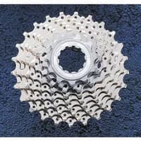 Silver Shimano HG50 9-speed cassette with multiple sprockets and intricate gear teeth pattern.