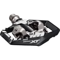 Black and silver Shimano PD-M8120 Deore XT SPD pedal with wide platform and clipless design.