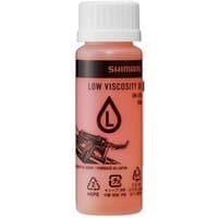 Shimano SM-LVOIL Low Viscosity Mineral Oil in a pink bottle with black cap and label featuring a droplet icon.