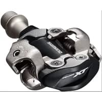 Black Shimano XT PD-M8100 SPD pedals with silver clipless mechanism and logo detailing.