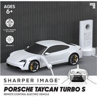 White RC Porsche Taycan Turbo S with charging cable, black wheels, and remote control, for ages 6 and up.