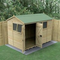 Wooden double door shed with reverse apex roof, green felt, and windows, set on a grassy area with a fence backdrop.