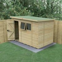 Wooden pent shed with tongue and groove panels, green roof, two windows, and a single door, set on a concrete base.