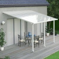 White Palram Canopia patio cover with clear panels, attached to house over wooden deck with outdoor dining set.