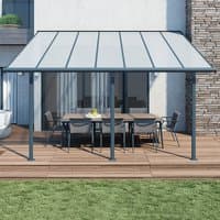 Grey Palram Canopia Sierra patio cover with clear roof panels and sturdy metal frame over outdoor dining set.