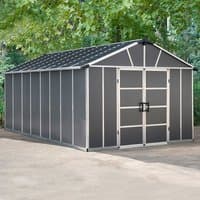 Dark grey plastic shed with WPC floor, gabled roof, double doors, and silver trim, set on a concrete surface.