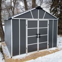 Dark grey plastic shed with skylight, double doors, and WPC floor, featuring white trim and pitched roof.