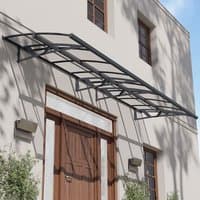 Grey metal and clear panel door canopy with arched design and wall-mounted brackets, covering a large entrance.