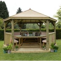 Luxury wooden garden gazebo with timber roof, open sides, and seating for 19, set in a grassy area with surrounding plants.