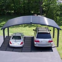 Grey metal double carport with curved roof, fits two cars, supported by four sturdy legs, sleek modern design.