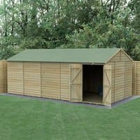 Wooden shed with double doors, reverse apex roof, windowless design, pressure-treated overlap panels, green roof.