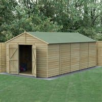 Wooden apex shed, 20' x 10', windowless, double doors, overlap cladding, green roof, set in grassy area.