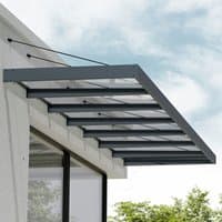 Grey Palram Canopia Sophia XL door canopy with clear panels, metal frame, and support rods, mounted above a window.
