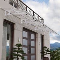 White Palram Canopia Bordeaux canopy with clear panels and modern design, covering large double doors.