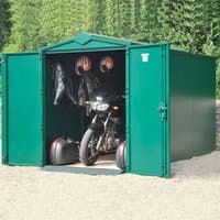 Green metal Asgard motorbike garage with double doors open, revealing a parked motorcycle and hanging gear inside.