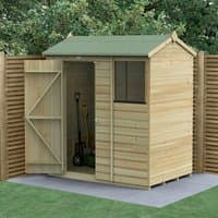 Wooden shed with reverse apex roof, shiplap panels, single door, and window, set on a paved base against a fence.