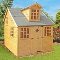 Wooden playhouse with pitched roof, dormer window, diamond-shaped door window, and multiple square windows.