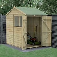 Wooden shiplap shed with green roof, double doors open, revealing lawnmower inside, set against garden backdrop.