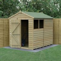 Wooden apex shed, 8'x6', pressure-treated, overlap panels, single door, green roof, window, set on grass.