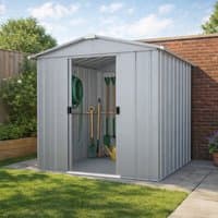 Silver metal shed by Yardmaster, 8' x 6', with double sliding doors, vertical ridges, and garden tools inside.