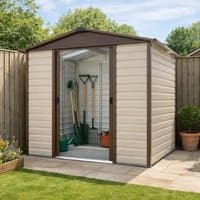 Brown metal shed with shiplap design, double sliding doors, and garden tools inside, set on a patio.