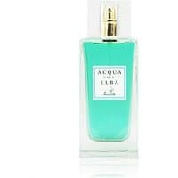 Clear glass bottle with turquoise perfume, gold spray nozzle, and white label reading "Acqua dell'Elba."