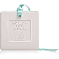 White square ceramic diffuser with embossed Acqua dell'Elba logo, teal ribbon attached.