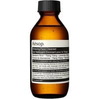 Amber bottle of Aesop Amazing Face Cleanser with black cap and white label, 100 ml size for oily skin.
