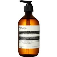 Amber bottle with black pump, Aesop Coriander Seed Body Cleanser label, 500 ml capacity.