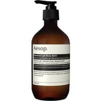 Brown pump bottle of Aesop Geranium Leaf Body Balm, 500 ml, with white label and black text.