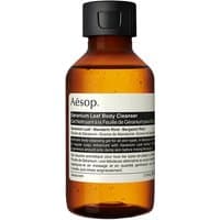 Amber bottle of Aesop Geranium Leaf Body Cleanser with black cap and white label, 100 ml size.