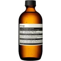 Amber bottle of Aesop In Two Minds Facial Cleanser, 200 ml, with black cap and minimalist black-and-white label.
