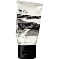 Aesop Moroccan Neroli Post-Shave Lotion, 60 ml, in a white tube with black text and a black flip-top cap.