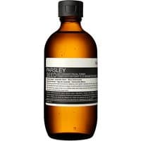 Amber bottle of Aesop Parsley Seed Facial Toner with black cap and minimalist white label.