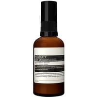 Brown bottle with black pump, labeled "Aesop Parsley Seed Anti-Oxidant Hydrator 60 ml" for dry skin moisturizing.