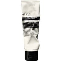 Aesop cream cleanser in a white, squeezable tube with black text and a black flip-top cap, 100 ml size.