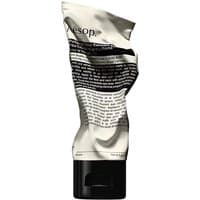 Aesop Purifying Facial Exfoliant Paste in a crumpled beige tube with black text and a black cap, 75 ml size.