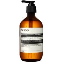 Amber bottle with black pump, Aesop label, Resurrection Aromatique Hand Wash, 500 ml, minimalist design.