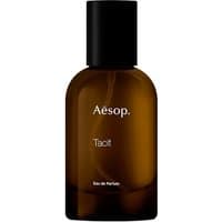 Aesop Tacit Eau de Parfum 50 ml bottle, amber glass with black cap, white text label, unisex woody fragrance.