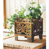 Bronze Butterfly Design Planter Rack with intricate butterfly cutouts and ornate legs, holding white flowers.