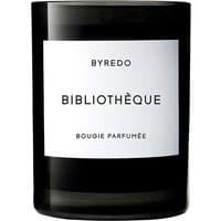 Black Byredo Bibliotheque candle in glass jar with white label and bold black text.
