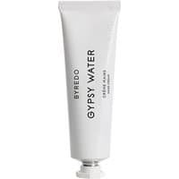 White Byredo Gypsy Water hand cream tube, black text, silver cap, 30 ml size.