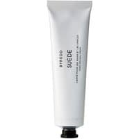 White tube of Byredo Suede Hand Cream, 100 ml, with black cap and minimalist text design.