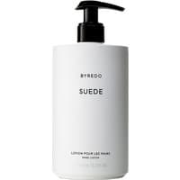 White Byredo Suede hand lotion bottle with black pump and minimalist text design, 450 ml size.