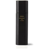 Black Byredo travel perfume case, sleek cylindrical design with gold text detailing.