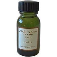 Green glass bottle with black cap, labeled "Christian Tortu Forets Pot Pourri Refill 15 ml" in elegant script.