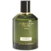 Green Christian Tortu Forets room spray bottle with black cap and gold accents, labeled "parfum d'ambiance."